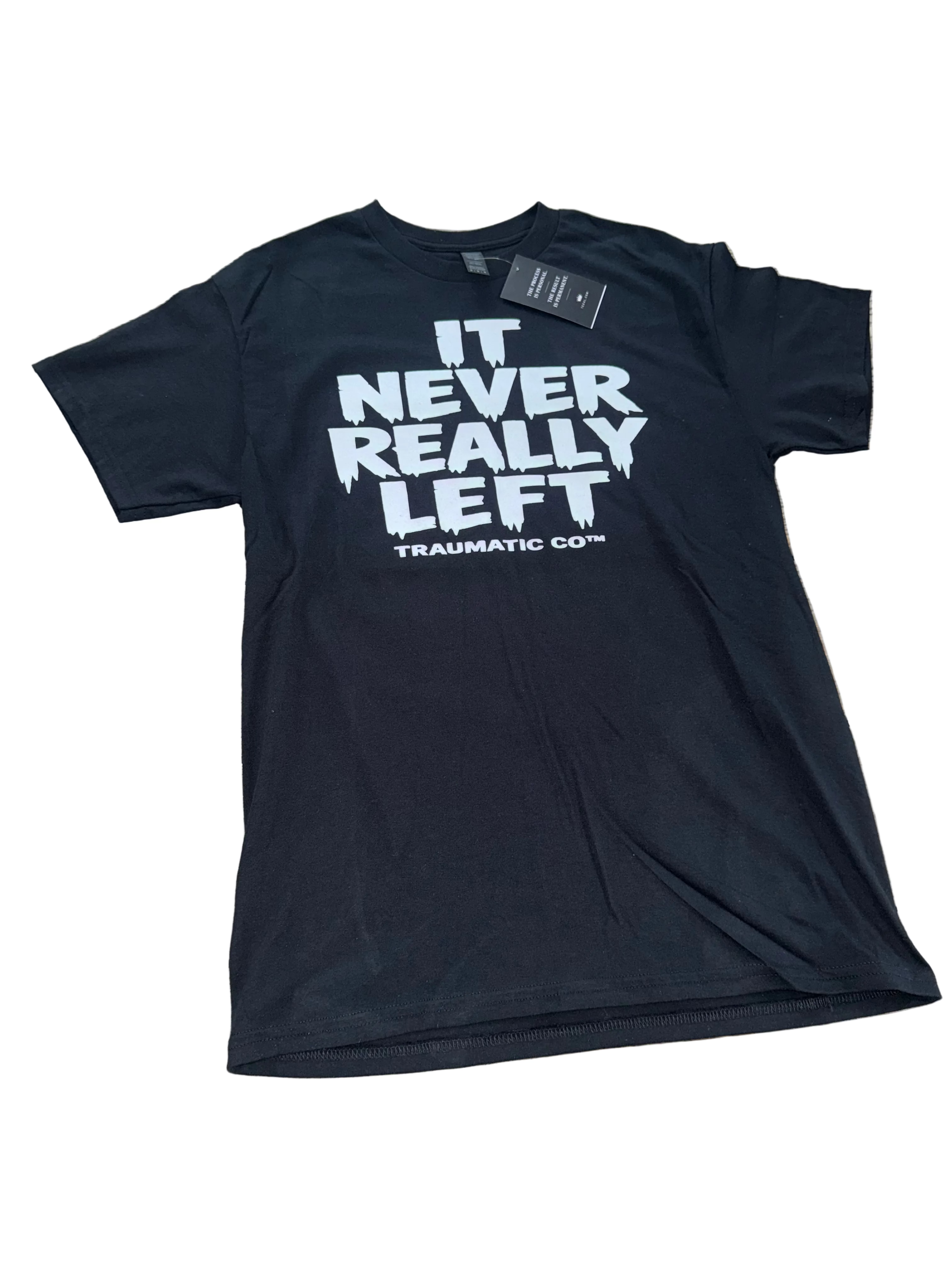 It Never Really Left | Traumatic Co ™ | Tee