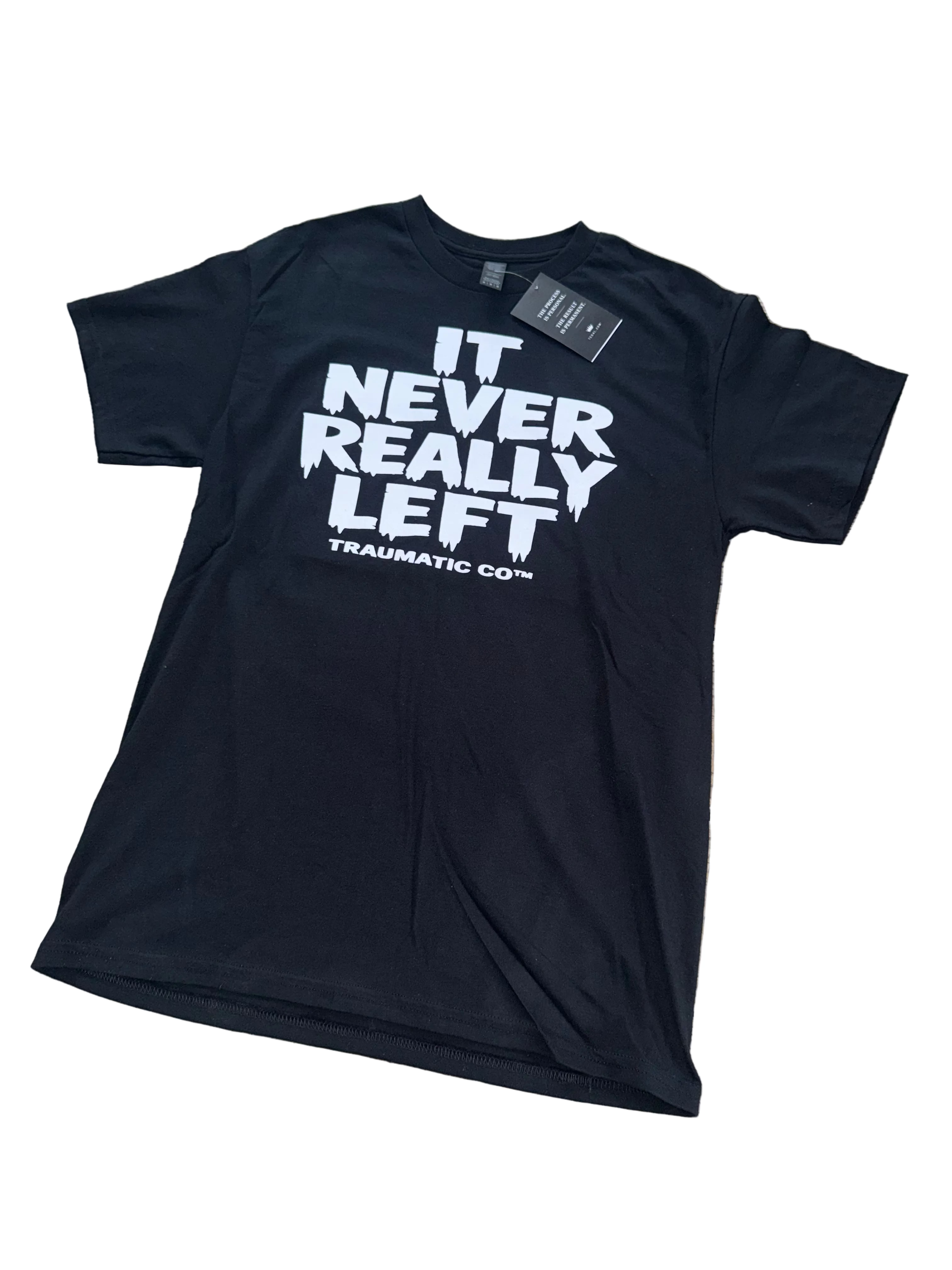 It Never Really Left | Traumatic Co ™ | Tee